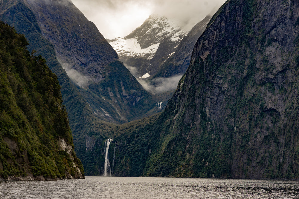 waterfall flowing through the side of a mountain