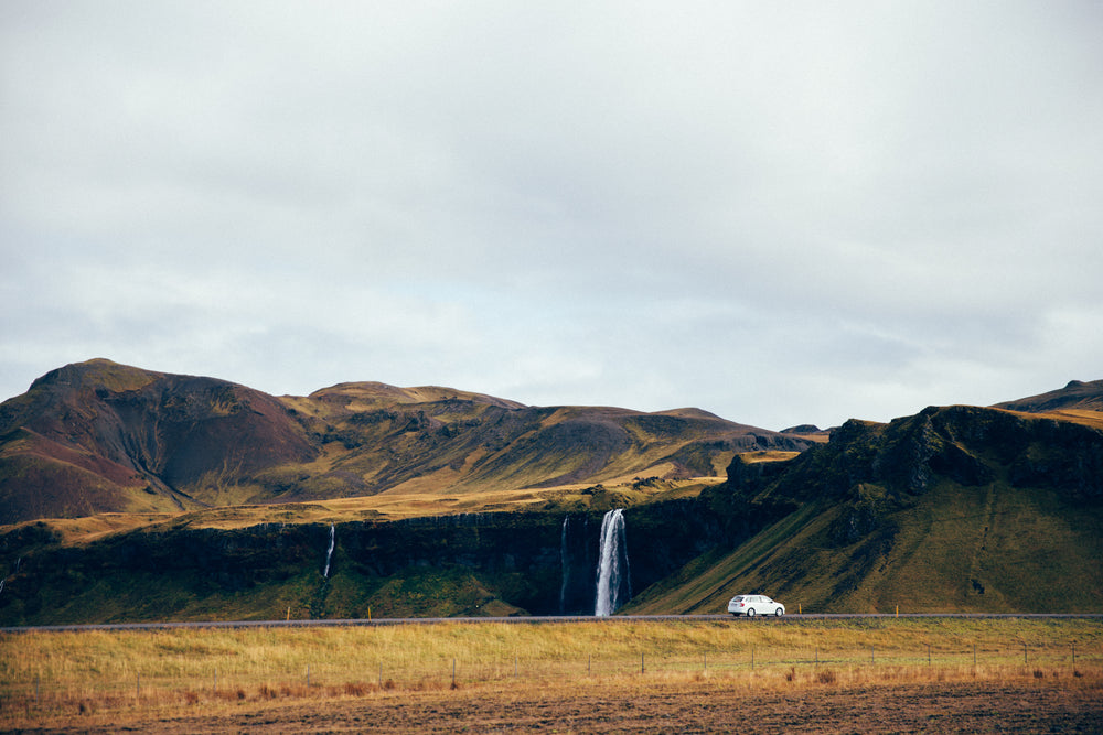 waterfall off roadside cliff