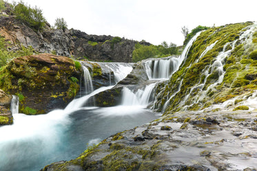 waterfall over rocky shores