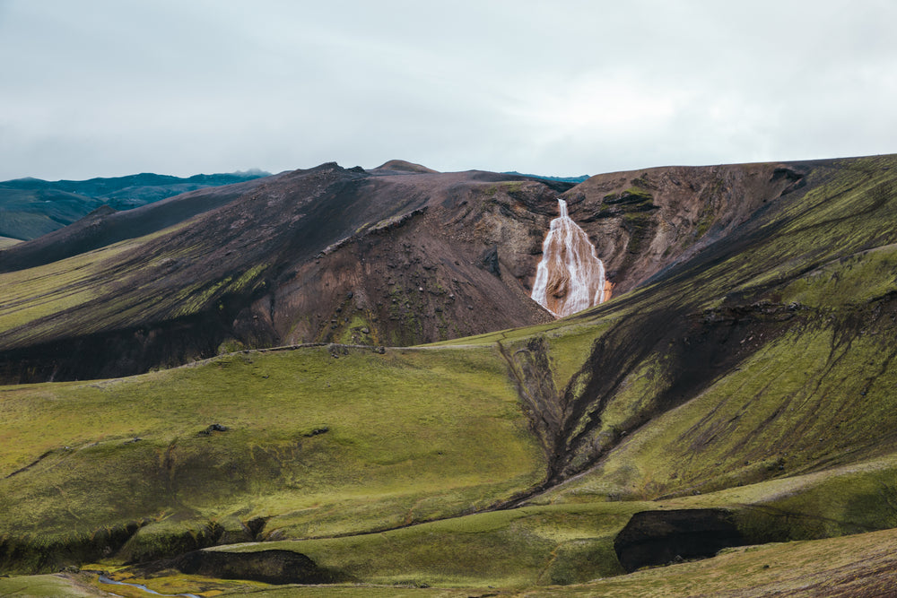 waterfalls & green hills