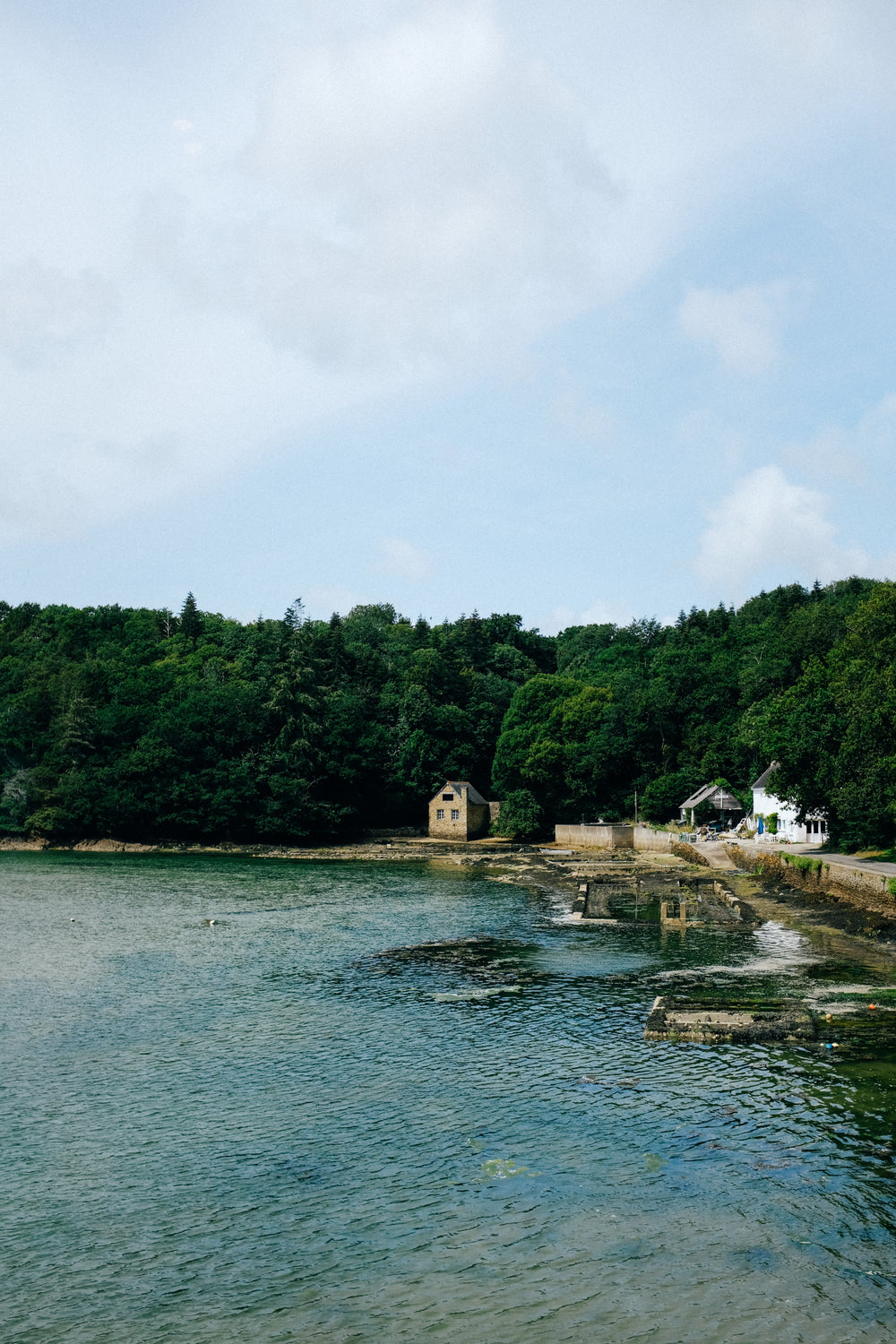 waterfront stone buildings by blue water