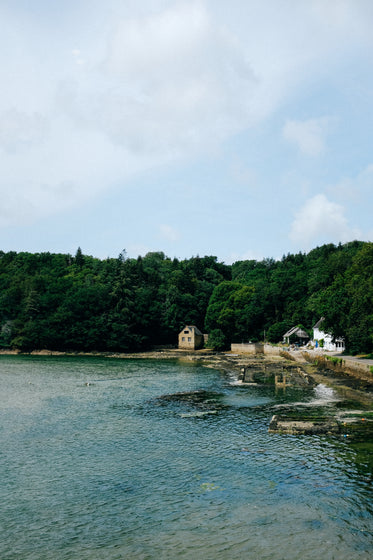 waterfront stone buildings by blue water