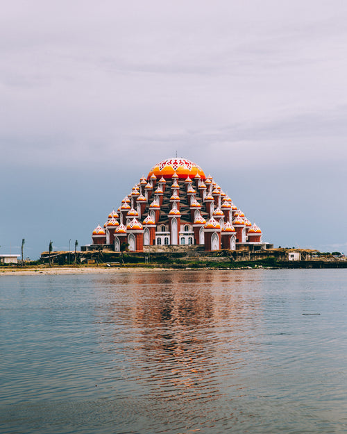 waterfront temple reflects into water