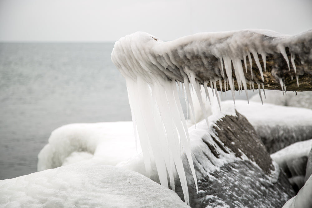 waterside rock with icicles