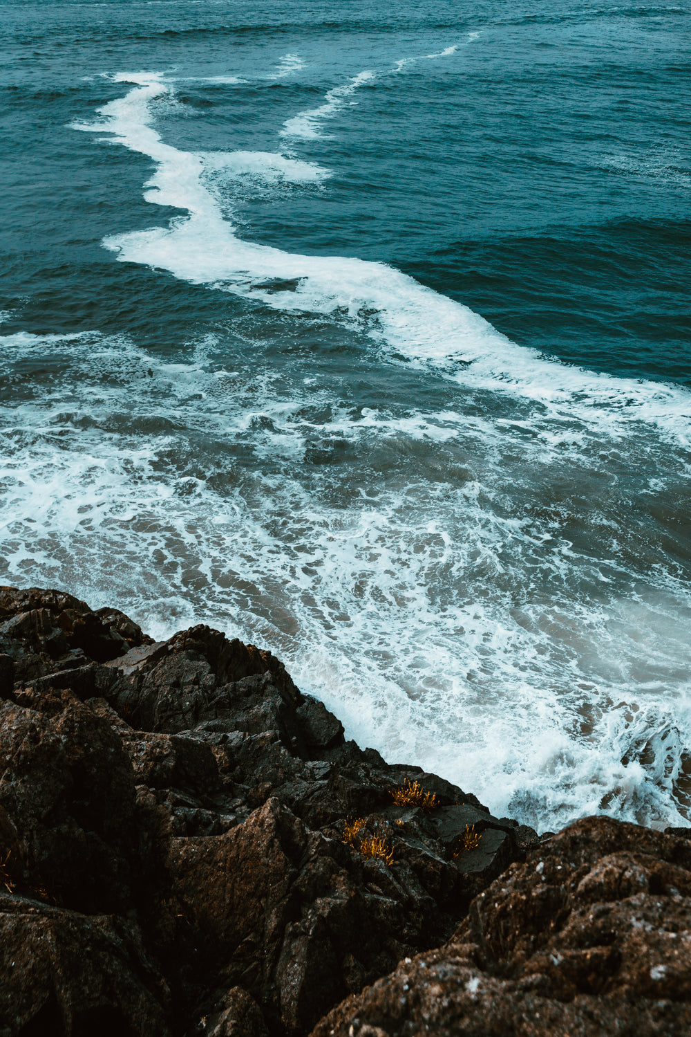 waves crash on rocks