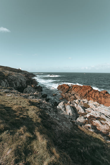 waves crash on rocky coastline