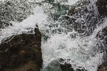 waves crash on sharp rocks