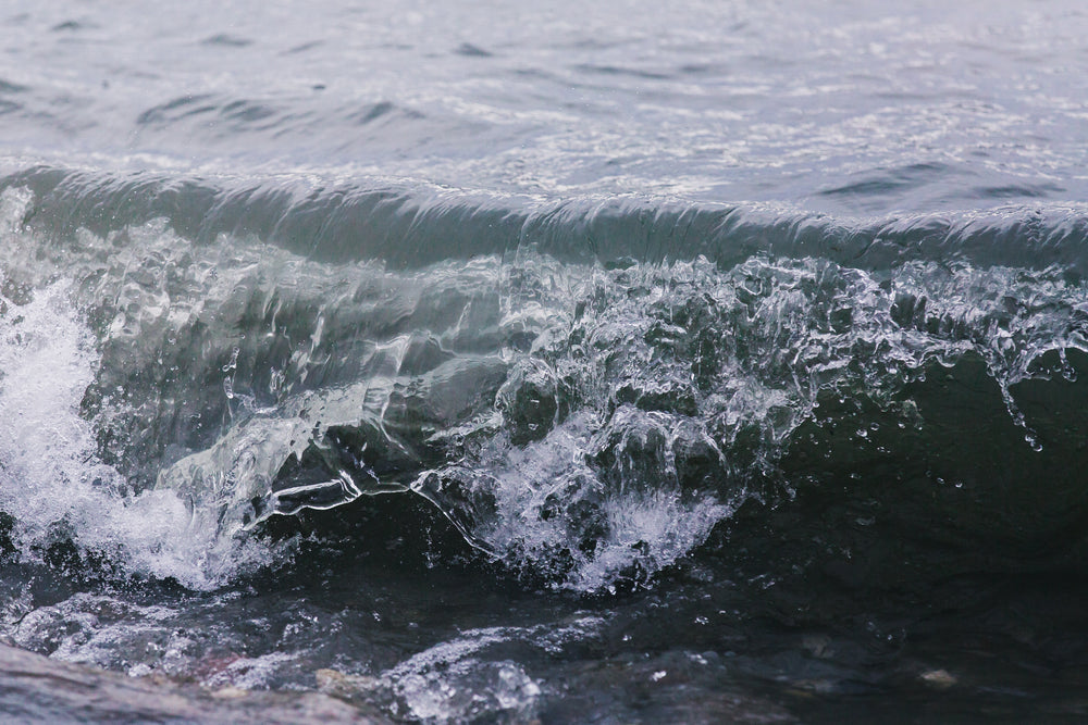 waves crashing on shoreline