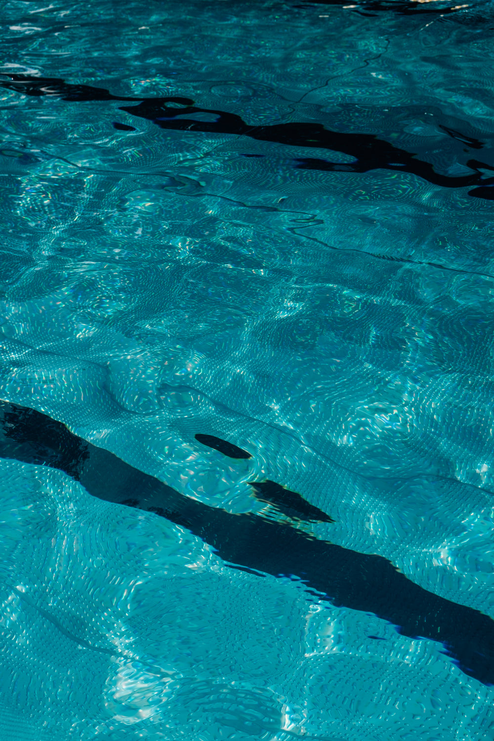 wavy water creating pattern in swimming pool