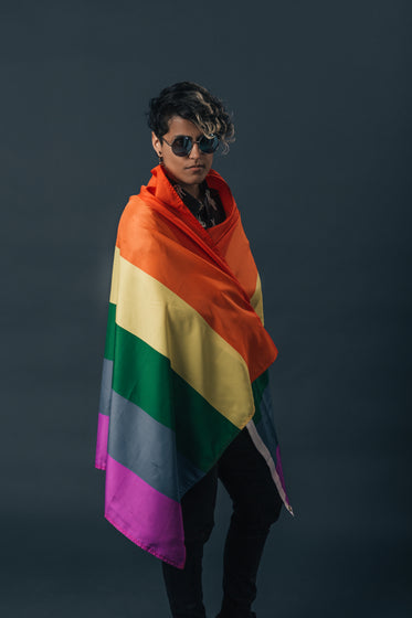 wearing the pride flag with shades