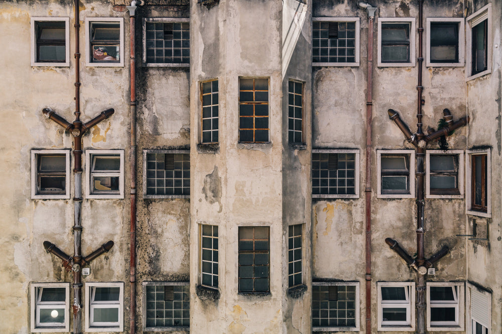 weathered and stained exterior of building