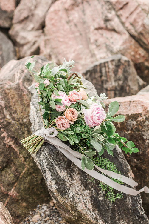 wedding bouquet on the rocks