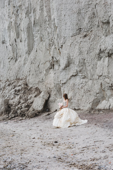wedding dress bride near rocky cliffs