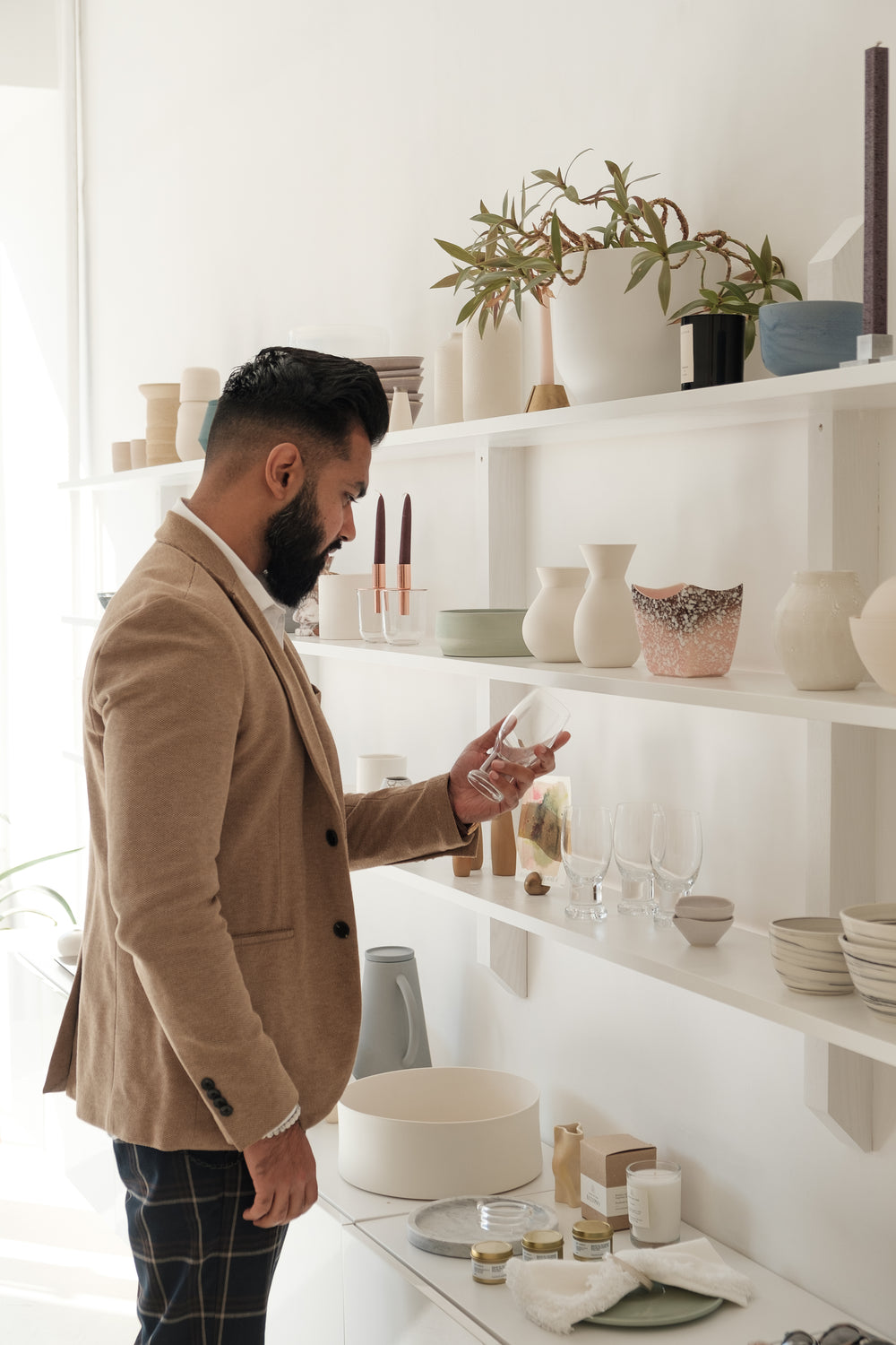 well dressed man looks around retail store