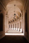 white arched hallway with natural light