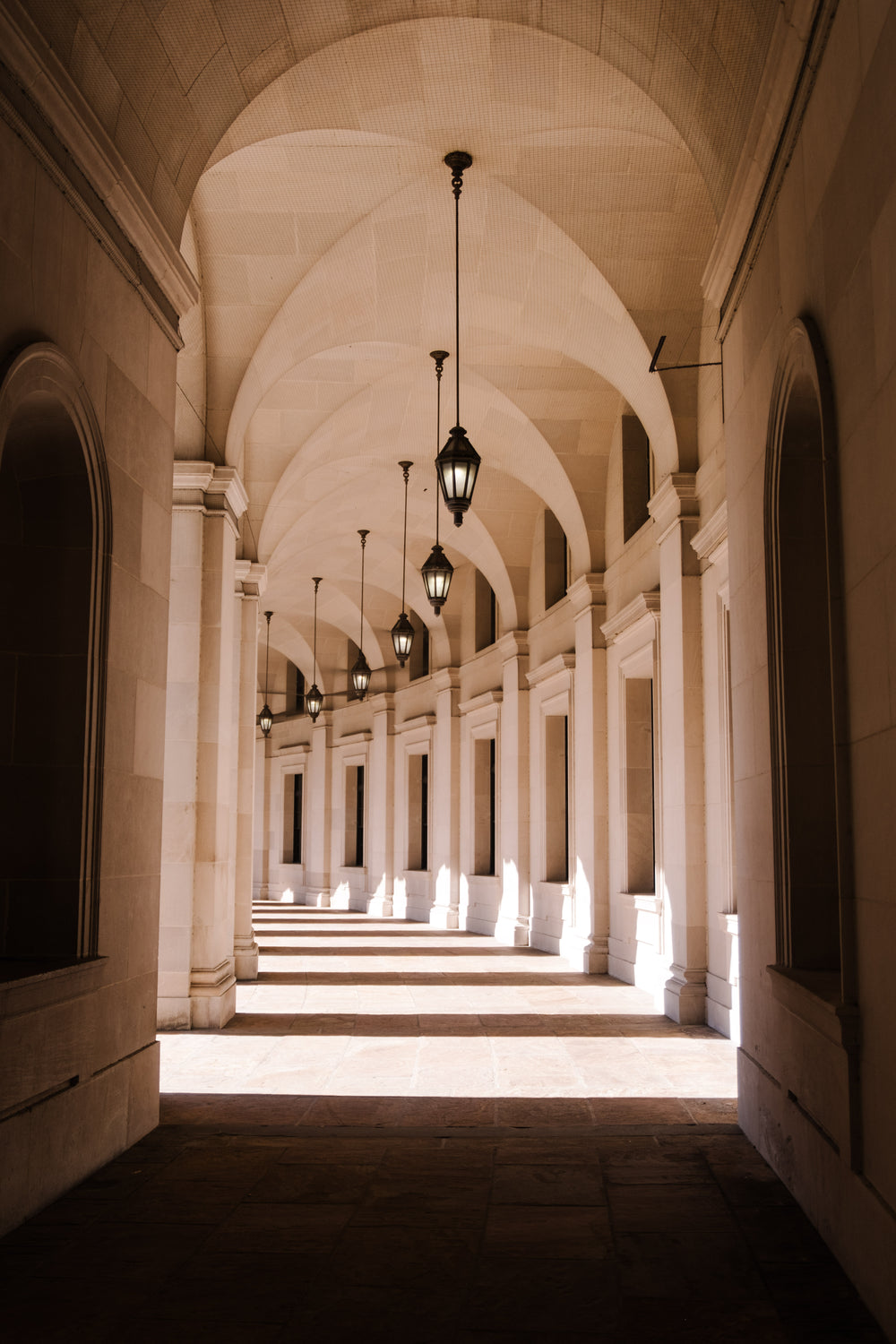 white arched hallway with natural light