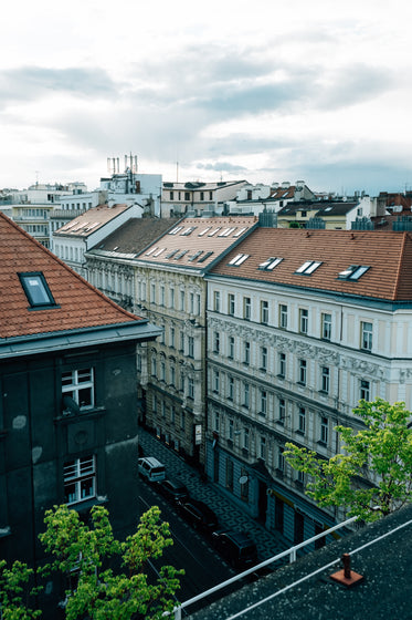 white building with skylights and rust colored roofs