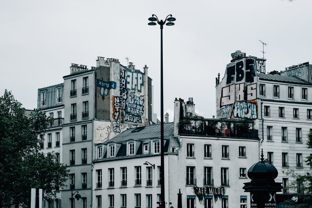 white buildings with graffiti covering the sides