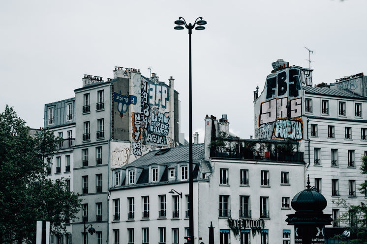 white-buildings-with-graffiti-covering-t