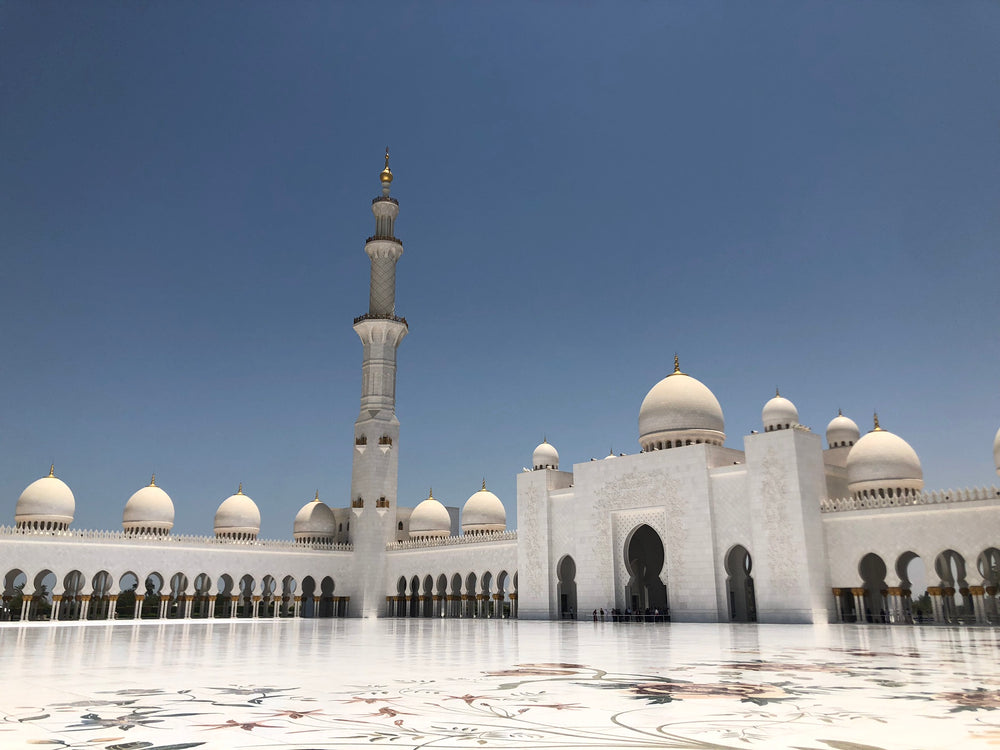 white buildings with round roof tops and keyhole doorways