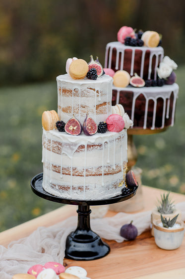 white cake on a black cake stand