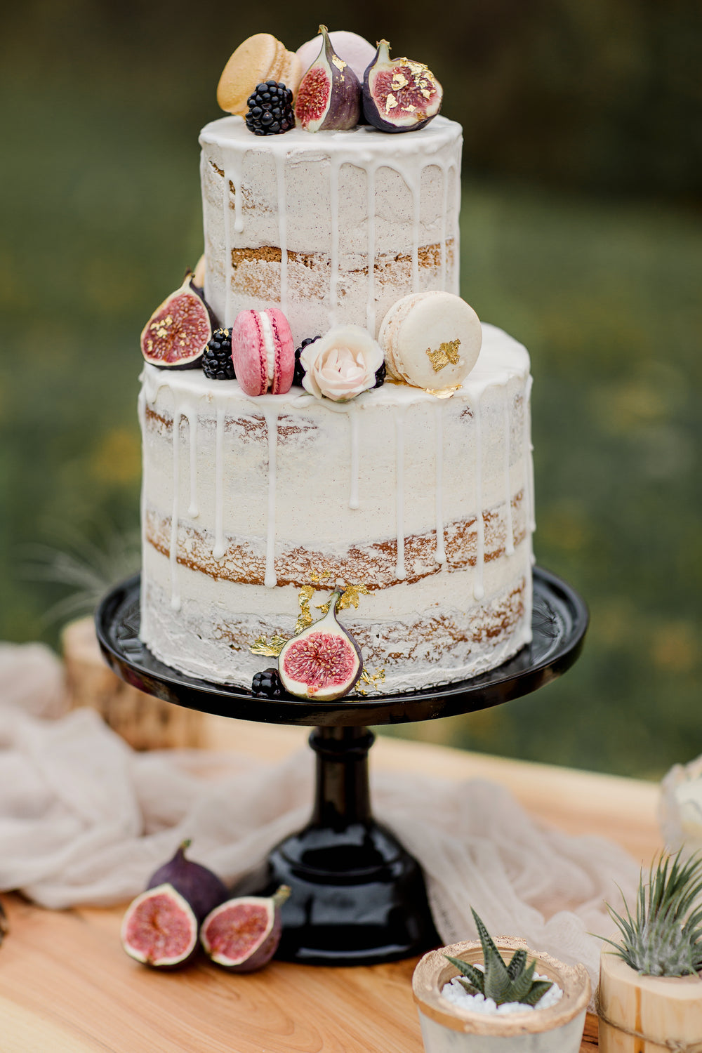 white cake on black cake stand