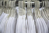 white cotton t-shirts on store rack