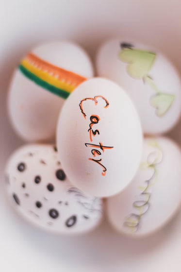 white eggs each decorated for easter