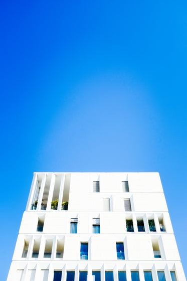 white modern building beneath blue sky