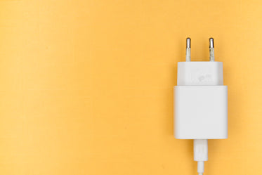 white phone charger on yellow