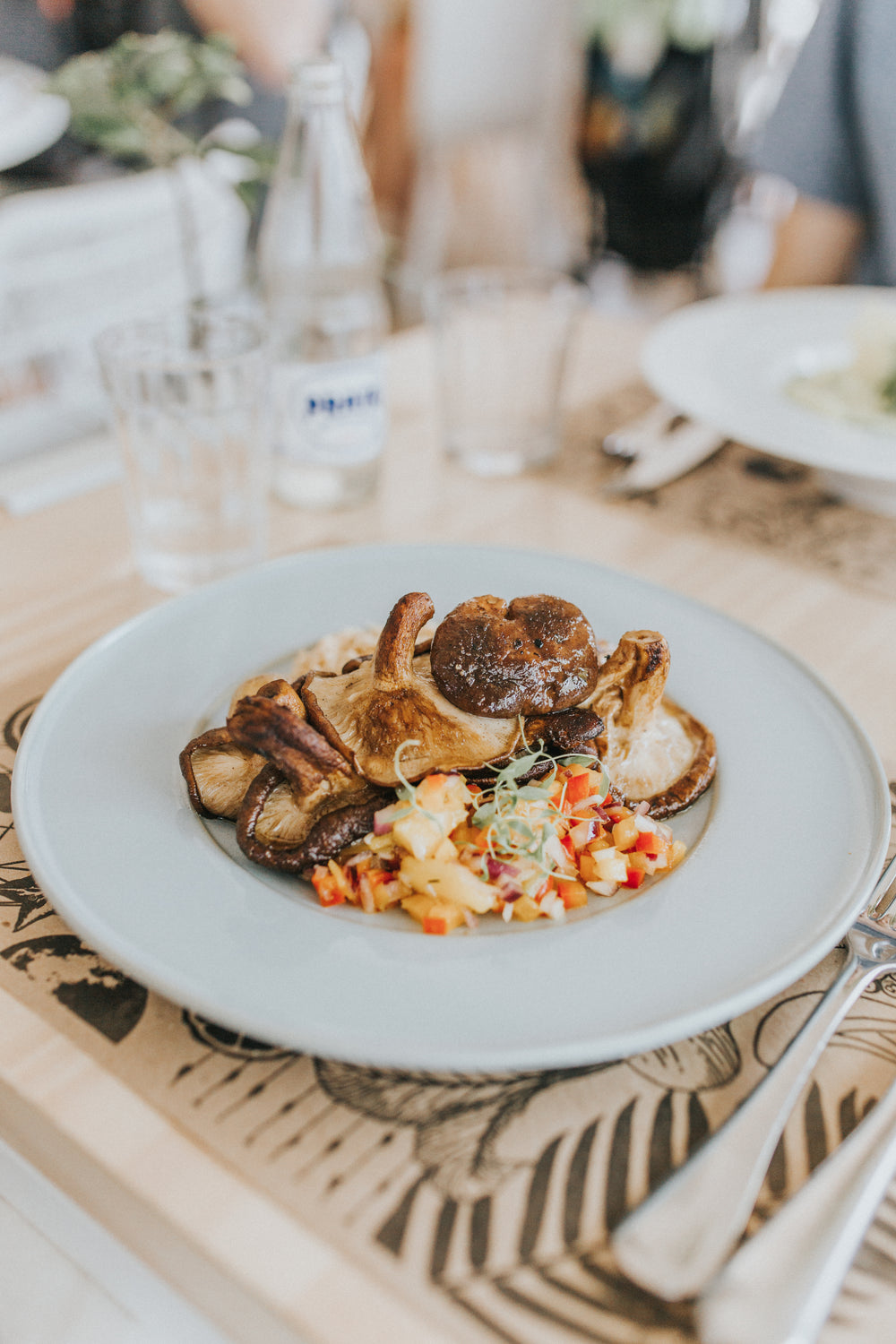 white plate with mushrooms and vegetables