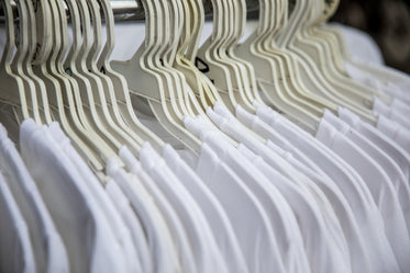 white t-shirts on clothing rack