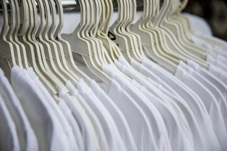 White T-Shirts On Clothing Rack