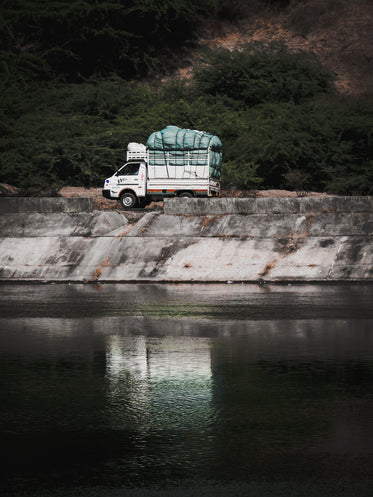 white truck parked by the water