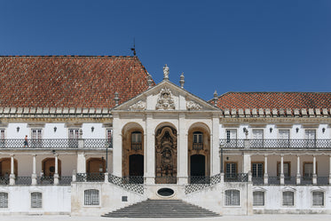 white villa with red tile roof