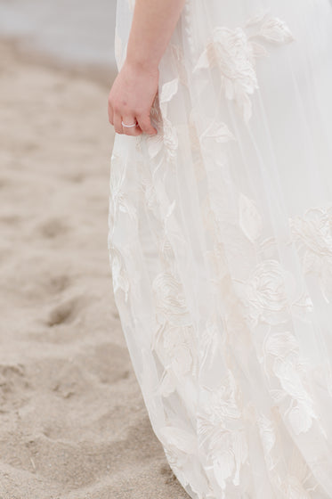 white wedding dress on a beach