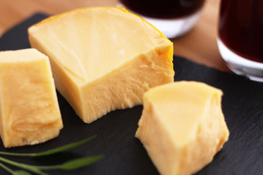 wine and cheese on slate board