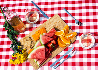 wine and fruit on picnic table