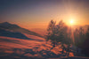 winter sun on snowy mountain