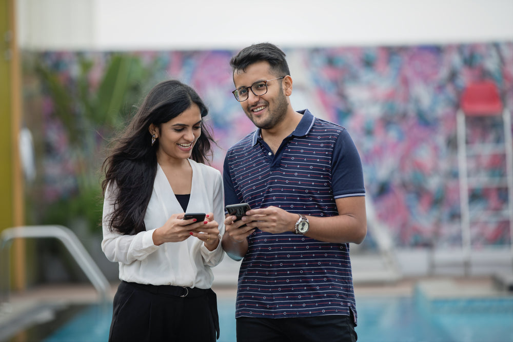 woman and man on mobile phones