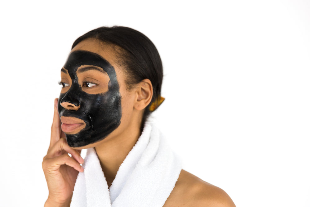 woman applying face mask