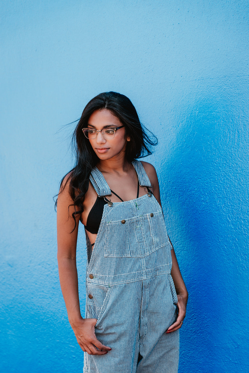 woman blue wall portrait