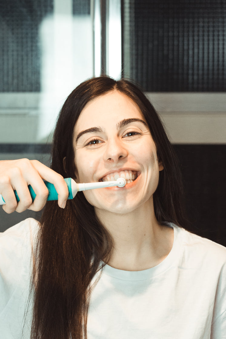 woman-brushes-her-teeth-with-an-electric