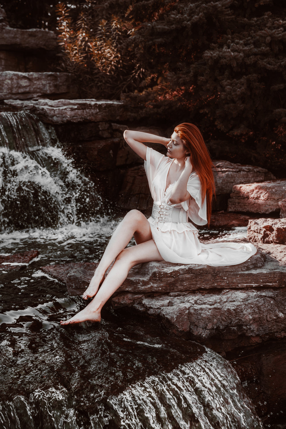 woman by waterfall