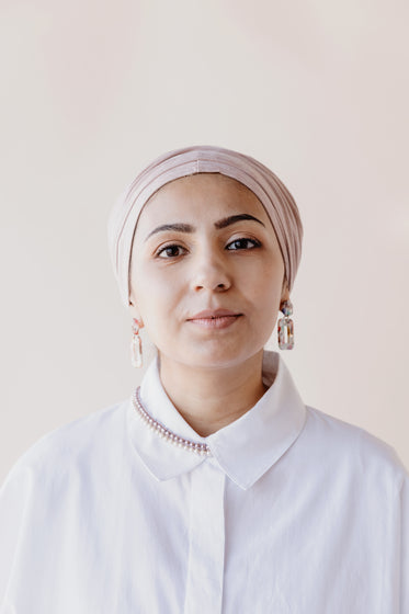 woman dressed in pale colors