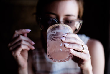 woman drinking cocktail