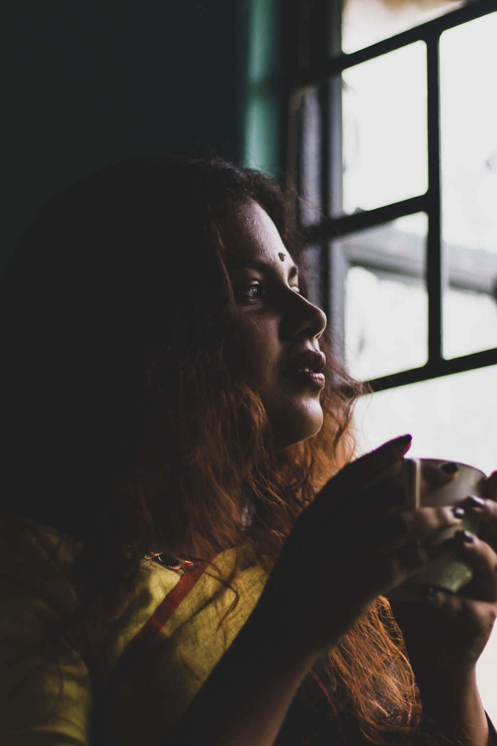 woman drinking tea watching the world