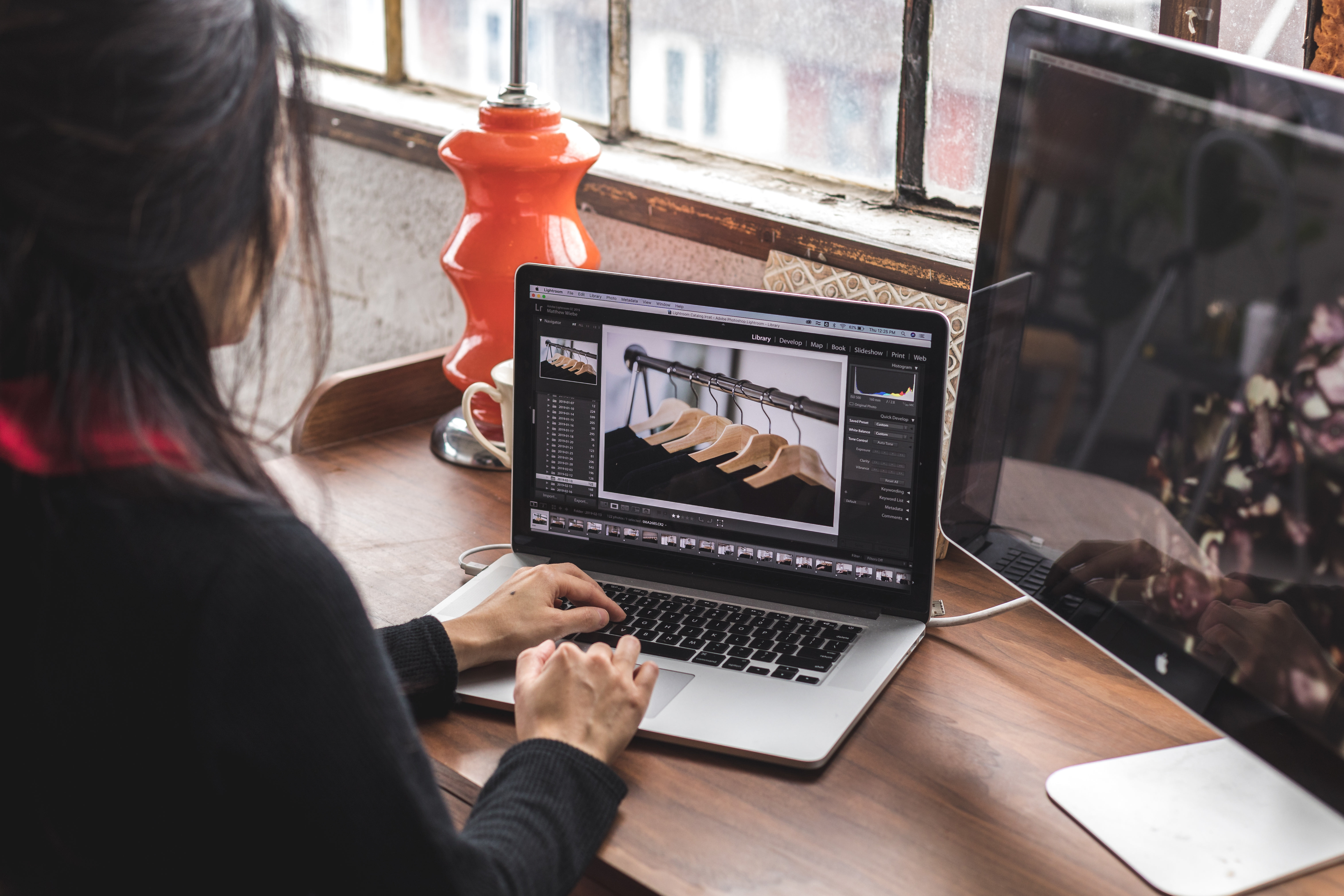 Woman Edits Images On Her Laptop