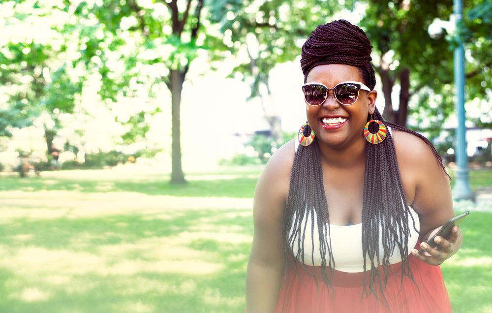 woman fashion model laughing at park