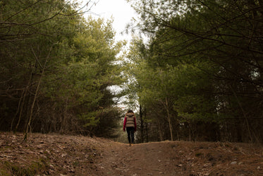 woman finds a clearing in the forest